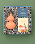 Bloom gift box with coral bud vase, garden lavender soap, and sea salt shower steamer.
