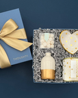 Elegant gift box for engagements, retirements, or special occasions with vase, jewelry dish, candy, and candle