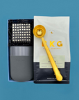 Thoughtful gift box for coffee lovers with medium-roast beans, tumbler, sweets, and coffee scoop
