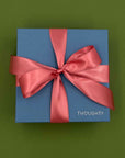 Thoughty gift box tied with a satin ribbon.