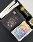 Celebration gift box with sweet treats, handover recovery kit, and party confetti
