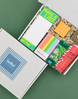 College exam care package with highlighters, notepad, sparkling energy drink and gummy candy