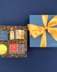 Thoughtful self care gift box with Peony Fields candle, citrus soap, sea salt shower steamer and lemon candy