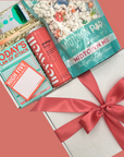 Motivation and productivity gift set with popcorn, snacks, and stationery items.