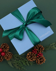Elegant Good Tidings Gift Box tied with a satin ribbon, perfect for employees or clients.