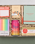 High Five college care package with colorful desk supplies, treats, sparkling water and self-care