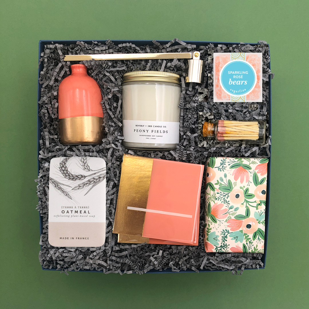 Elegant gift for hosts or housewarmings featuring vase, candle, gourmet treats, coasters, and soap