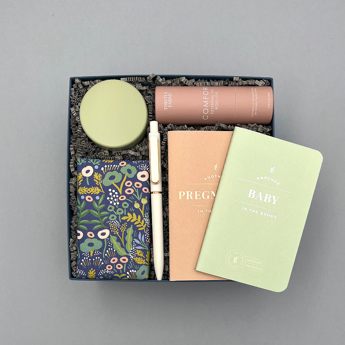 Mama to Be gift with pregnancy and baby journals, essential oil, candle, and gourmet cookies