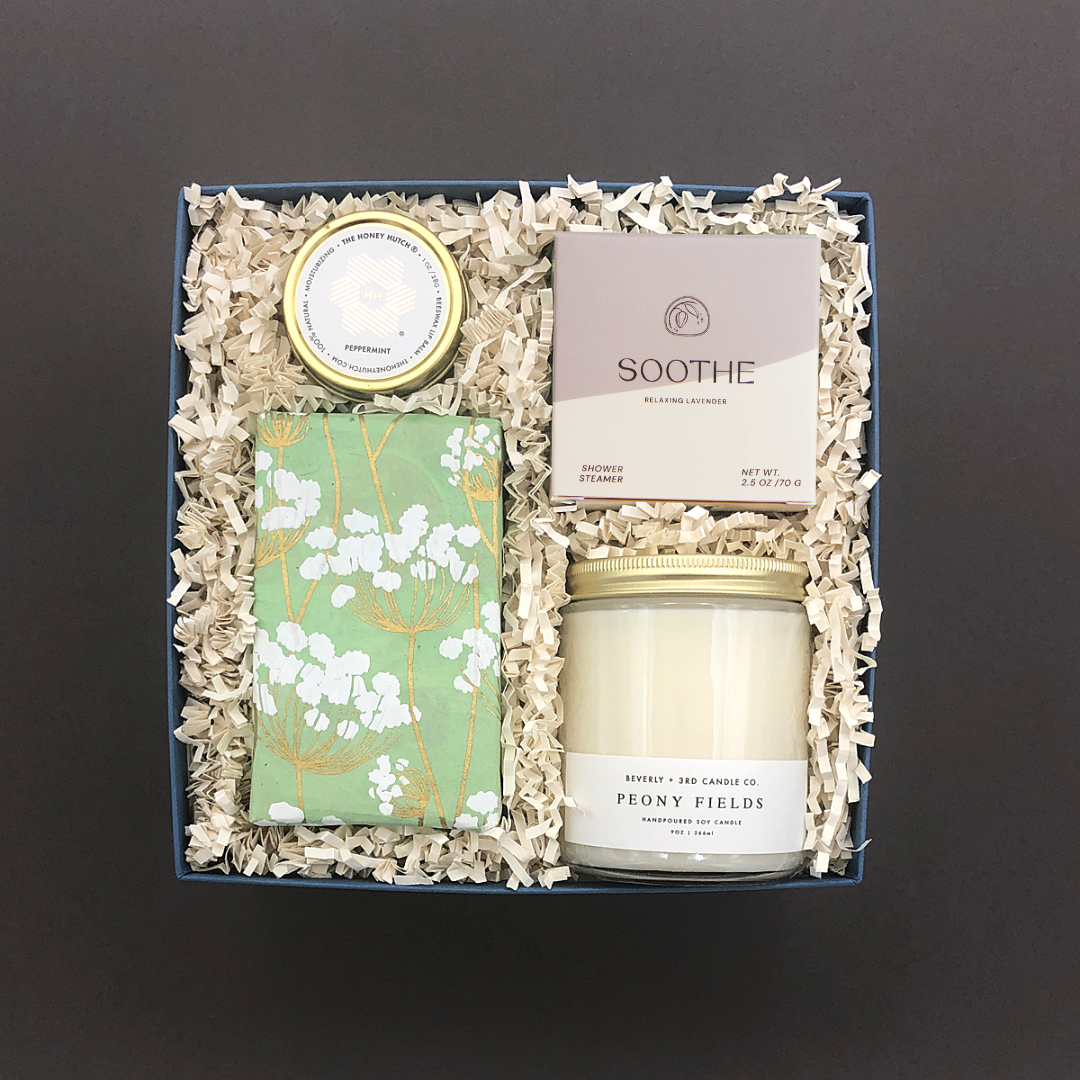 Mindful Moment Gift Box with Peony Fields candle, lavender shower steamer, peppermint lip balm, and salted caramel almond cookies