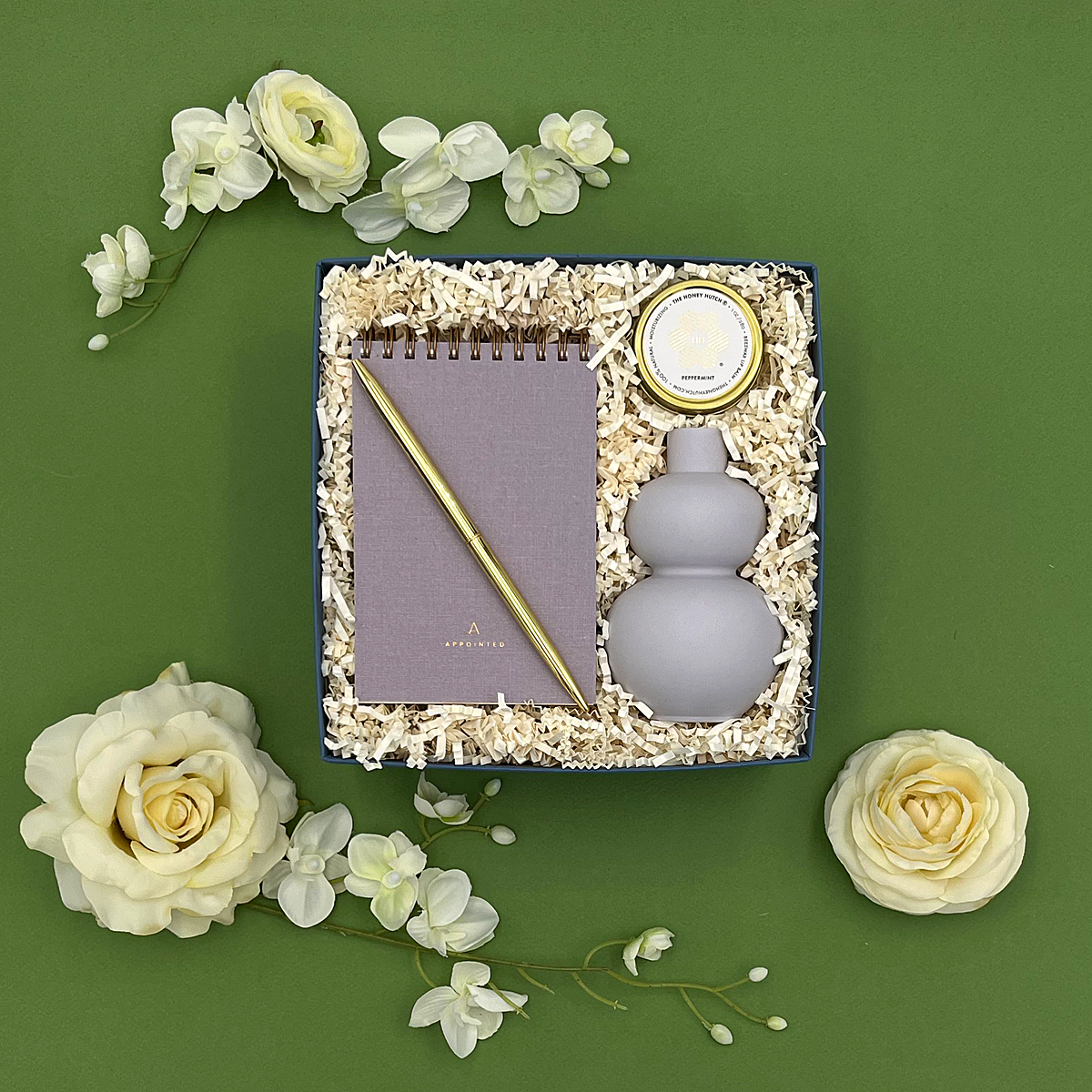 Lavender-themed Noted gift set including notebook, vase, lip balm, and elegant pen for birthdays, graduations, or appreciation