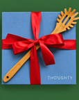 Thoughty Pasta Night gift box tied with satin ribbon and finished with a bamboo pasta server on the lid.