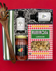 Thoughtful Italian-inspired gift box with pasta, sauce, and kitchen towel