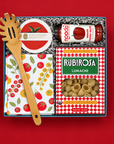 Italian-inspired pasta gift with Rubirosa lumache pasta, tomato sauce, colorful tomato towel, coasters, and bamboo pasta server.