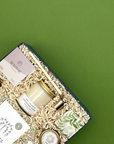 Restore Gift set with candles and soaps on a green background