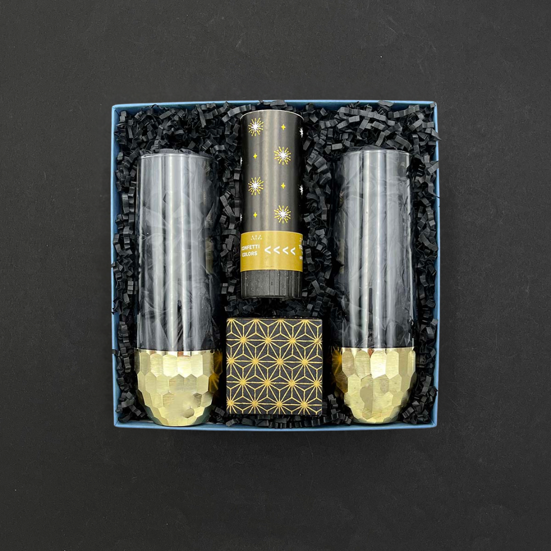 Sparkle Gift Box with gold champagne glasses, bubbly gummies, and confetti