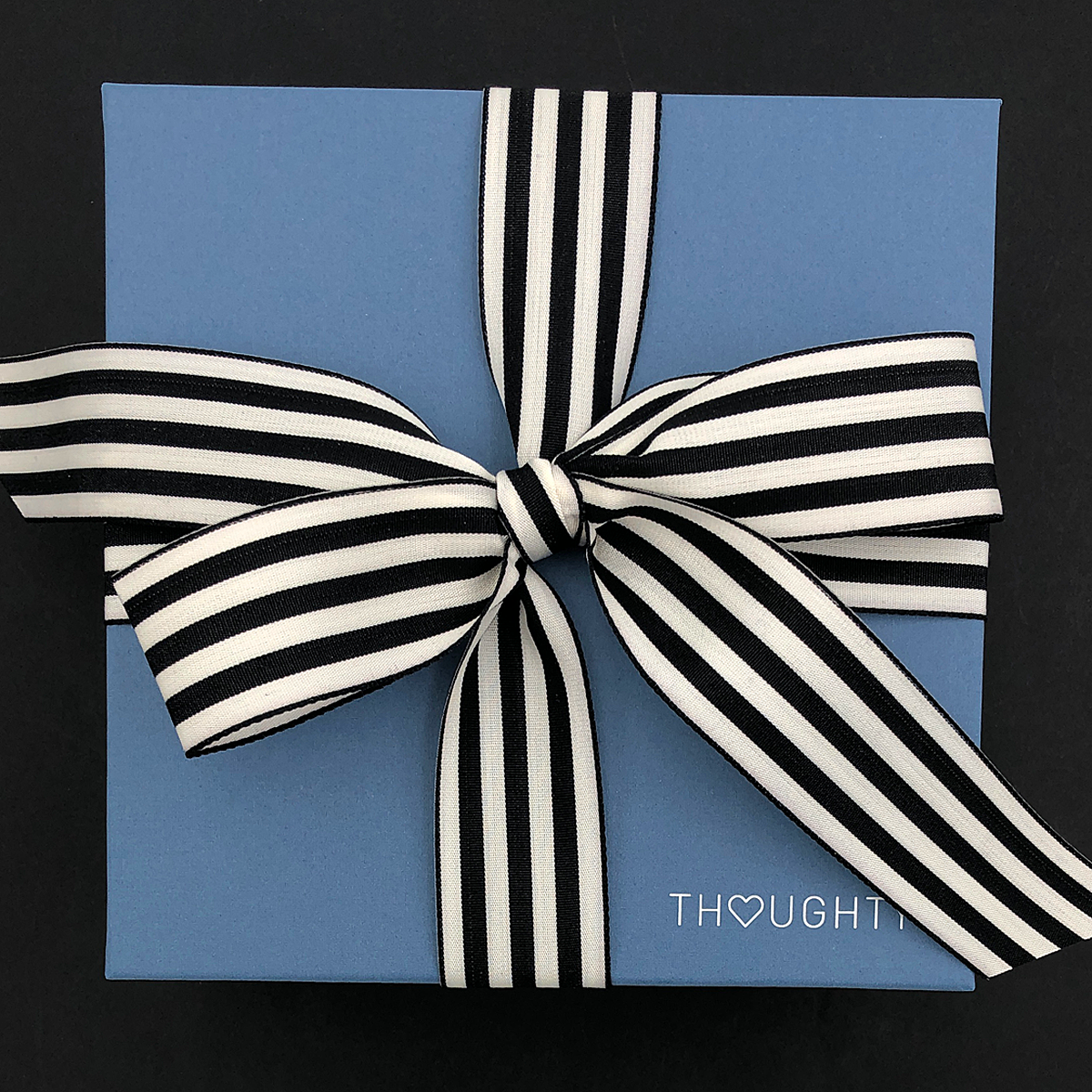 Workday gift box featuring travel tumbler, notebook, pen, and sparkling Bubbly Bears