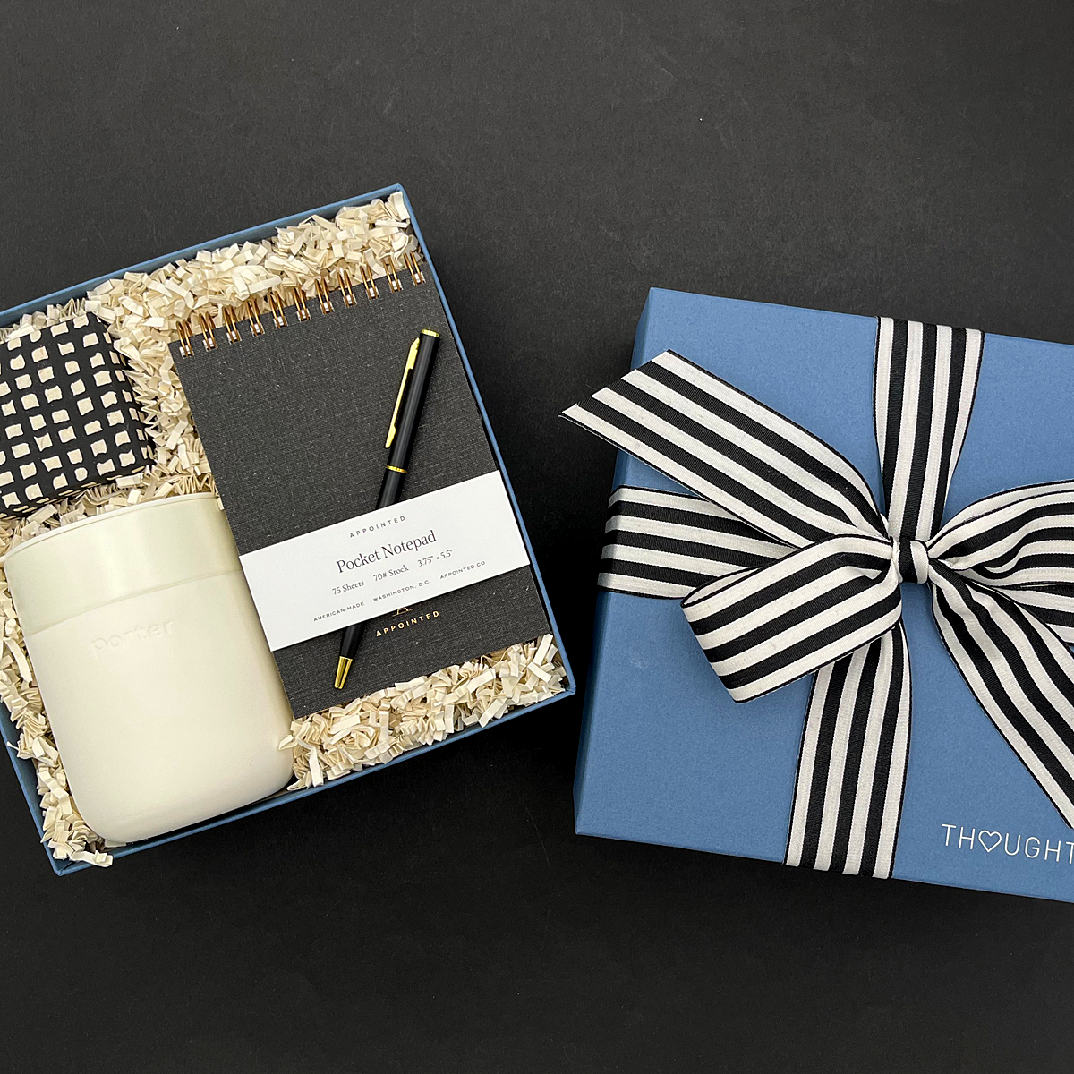 Thoughtful home office gift with notebook, pen, tumbler, and gourmet candy