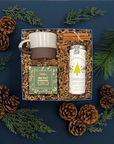 Fraser Gift Box with chai tea, holiday cookies, ceramic mug, and cinnamon sticks.