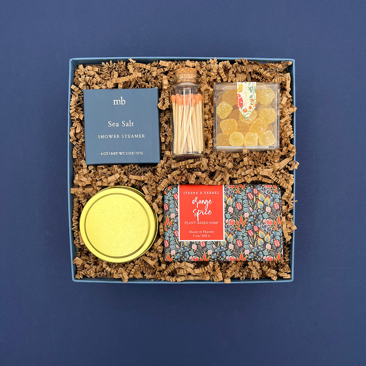 Fresh Start self care gift box with candle, orange spice soap, shower steamer, lemon candy and tangerine matches