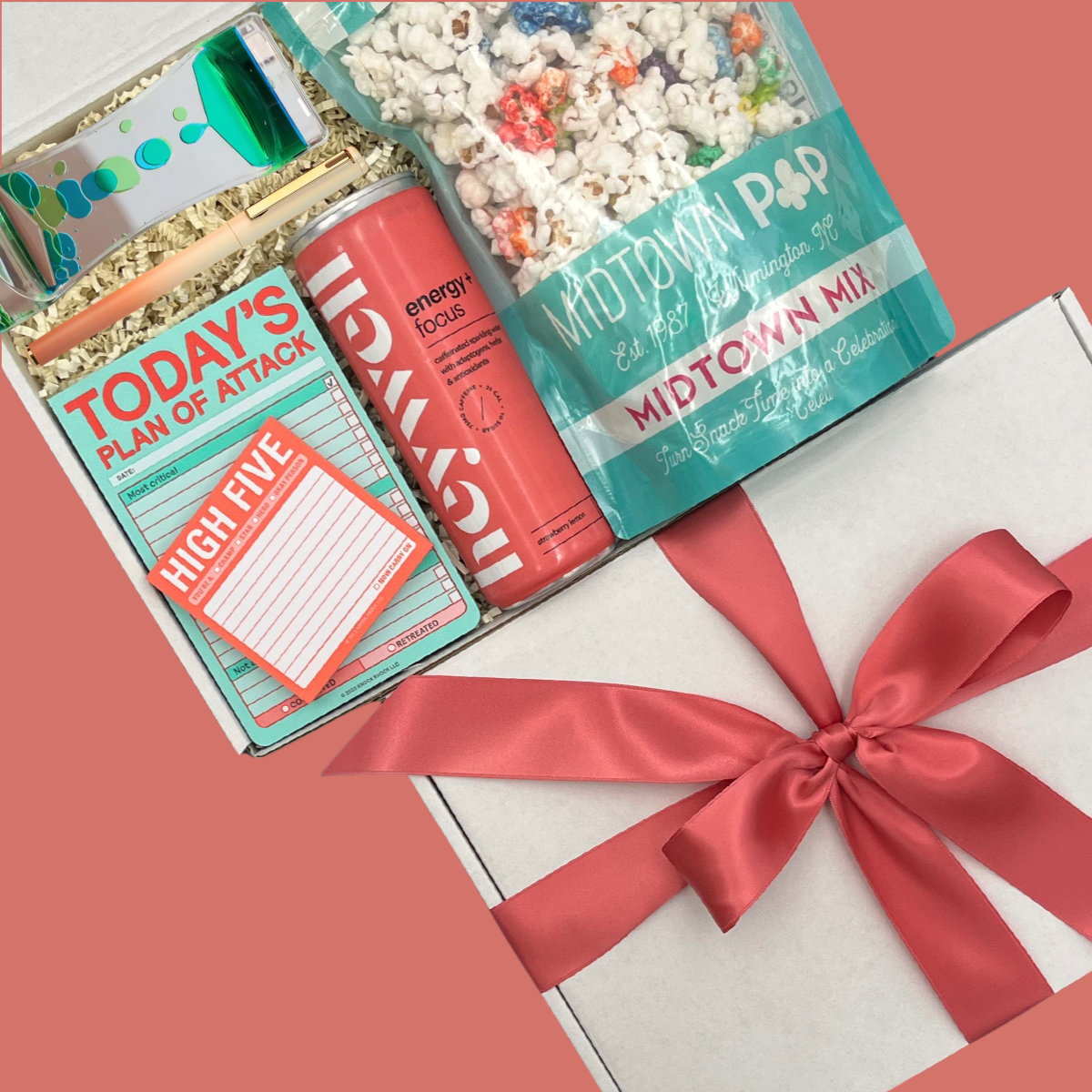 Motivation and productivity gift set with popcorn, snacks, and stationery items.
