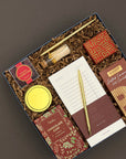 Hearth Gift Box displayed with gourmet snacks, cozy comforts, and festive packaging