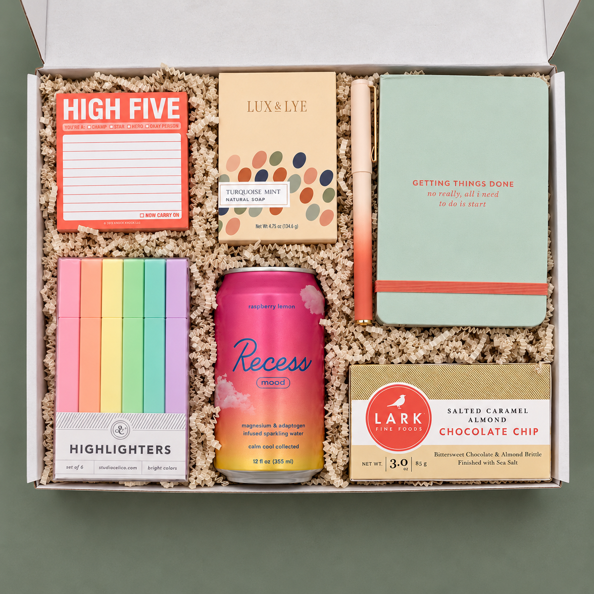 High Five college care package with colorful desk supplies, treats, sparkling water and self-care