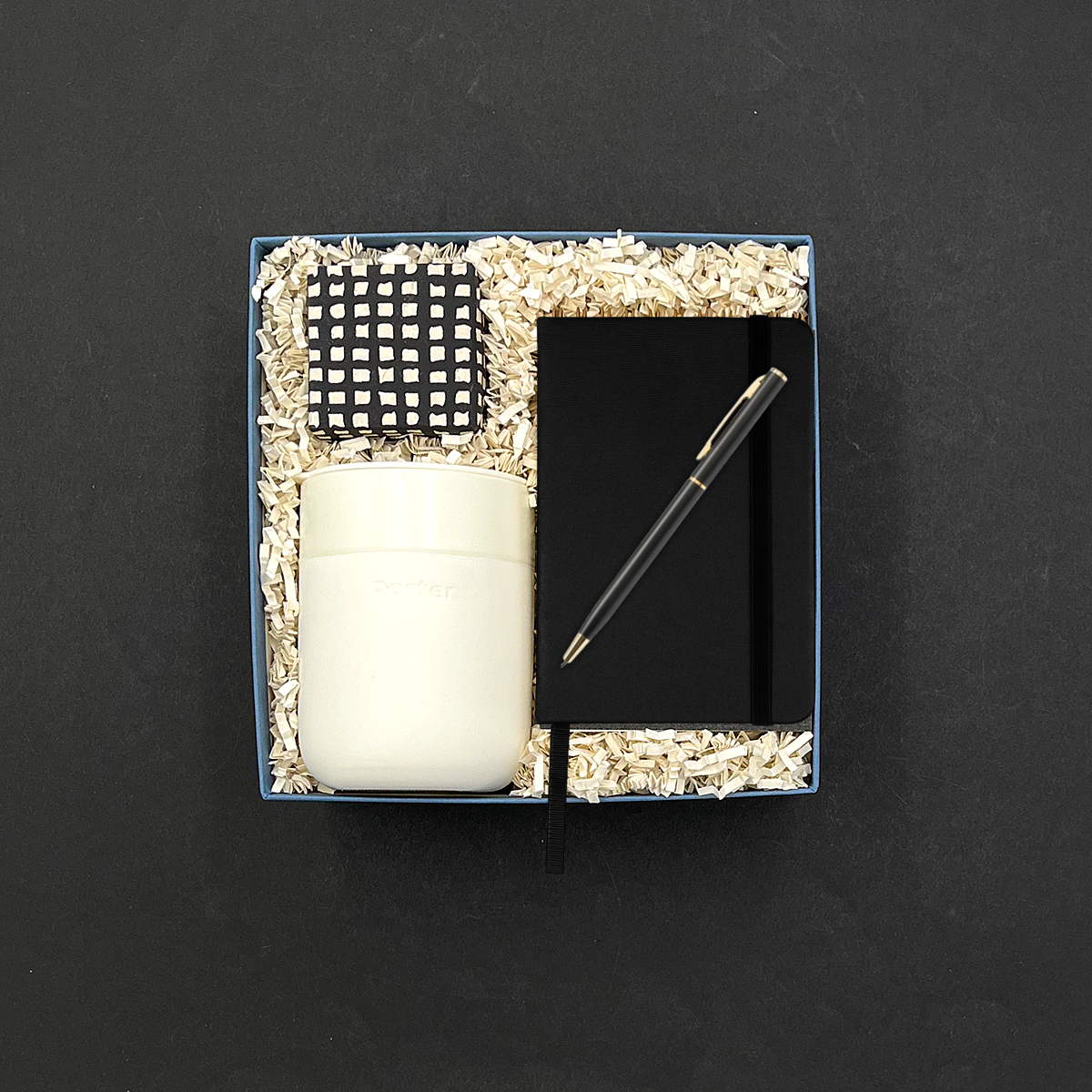 Desk gift box with stylish work essentials and sweet treats for employees or clients