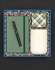 Home Office gift box with green journal, black and gold pen, travel tumbler, and colorful confetti caramels.