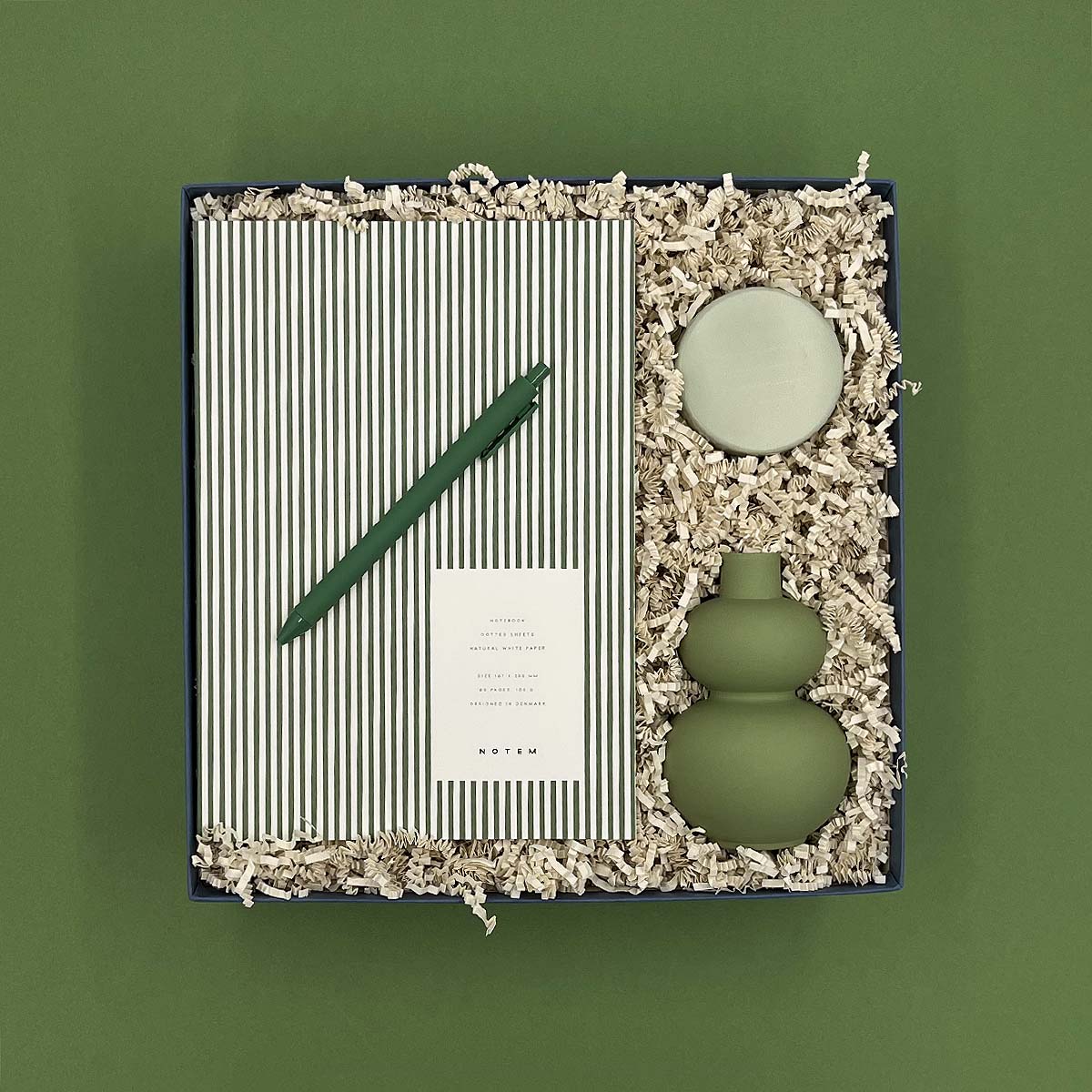 Thoughty Mint Condition gift box with sage green ceramic bud vase, Goa travel tin candle, green striped Notem notebook, and matching gel pen.
