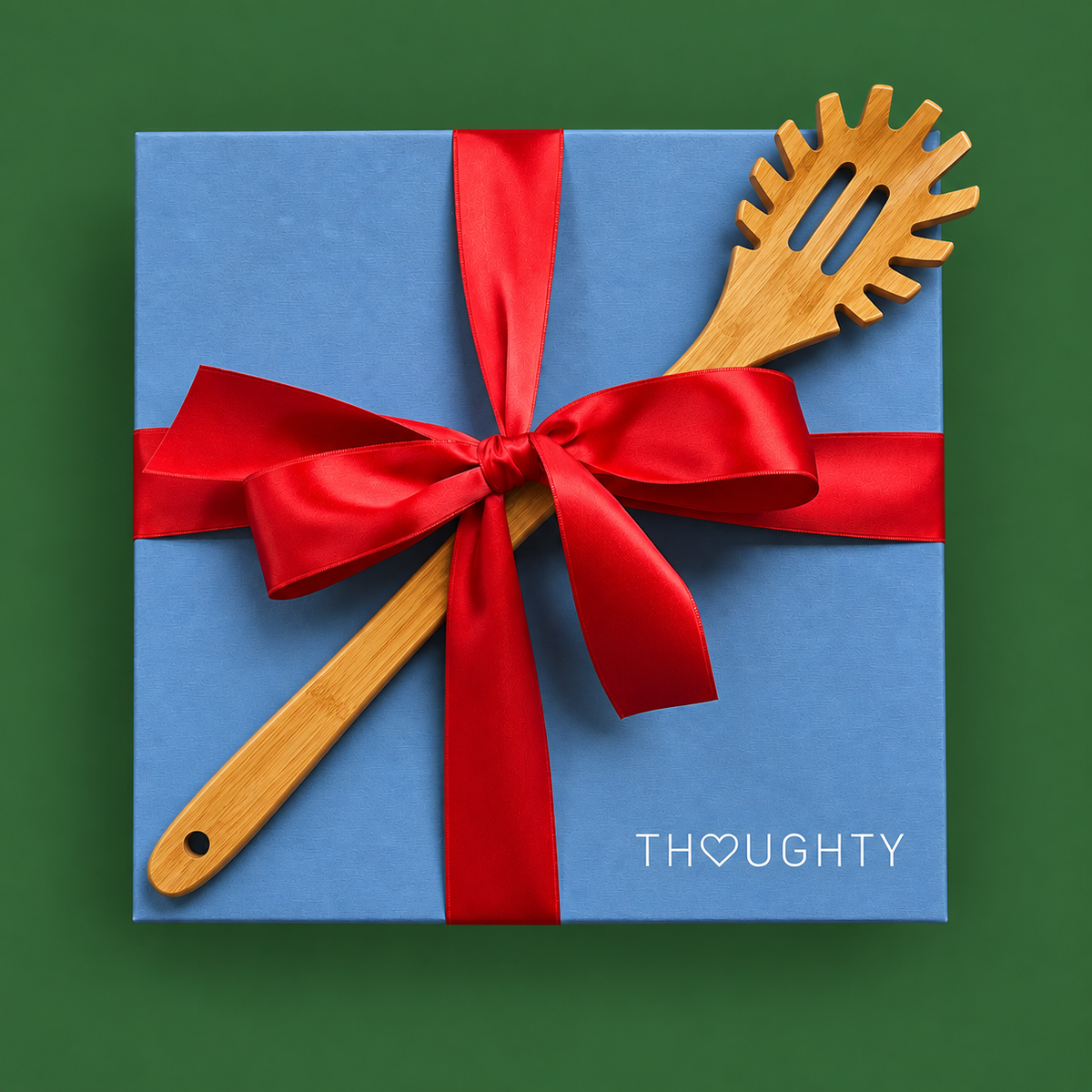 Thoughty Pasta Night gift box tied with satin ribbon and finished with a bamboo pasta server on the lid.