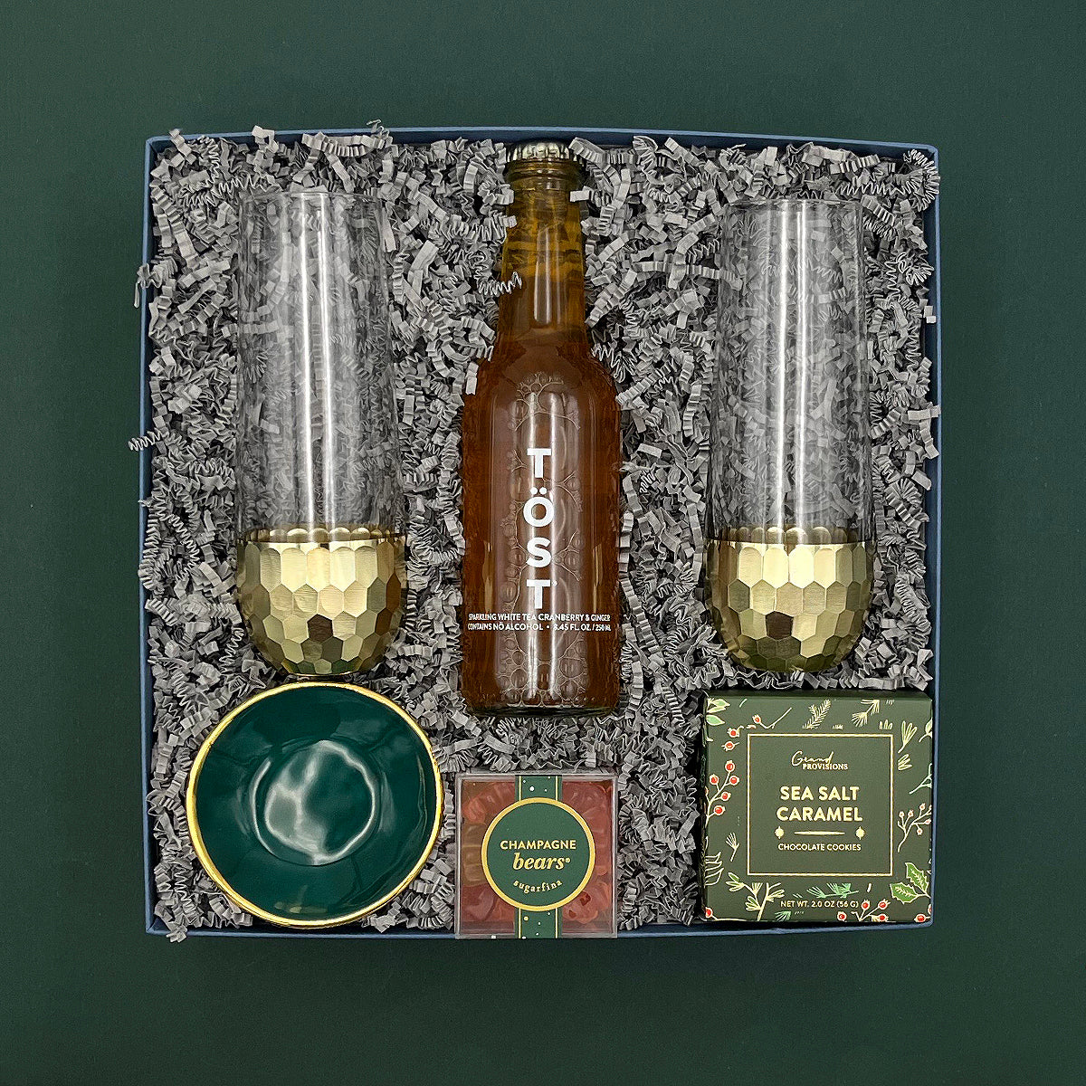Raise a Glass Gift Box with champagne glasses, cookies, sparkling beverage, and keepsake dish.