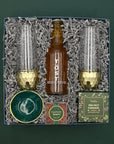 Raise a Glass Gift Box with champagne glasses, cookies, sparkling beverage, and keepsake dish.