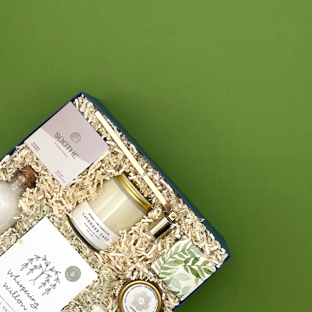 Restore Gift set with candles and soaps on a green background