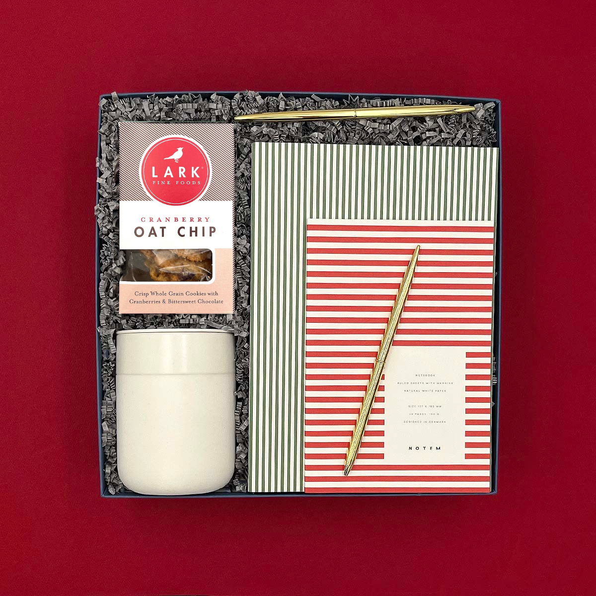 Season’s Greetings Gift Box with cookies, notebooks, tumbler, pens, and ribbon-wrapped packaging