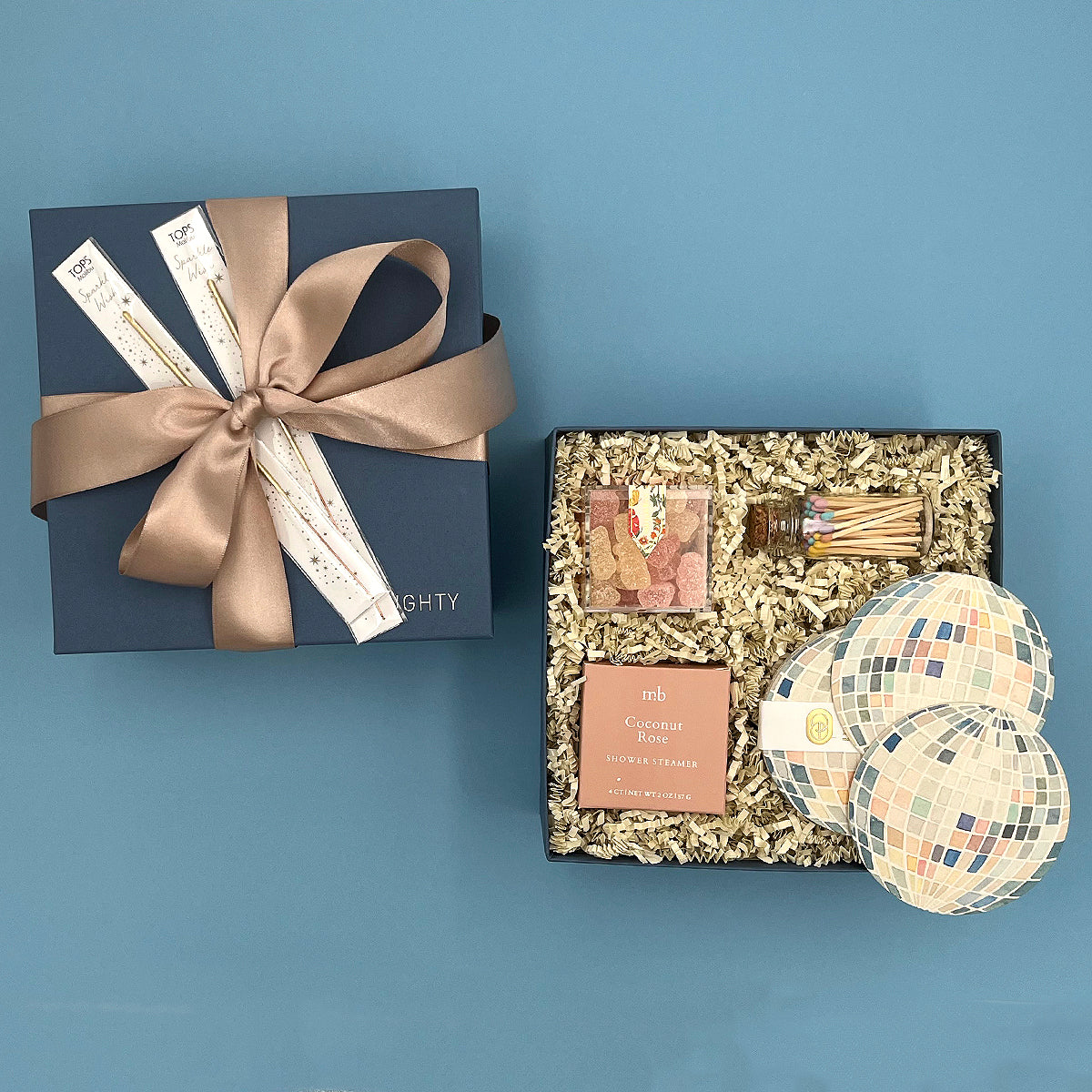 Shine On gift box with pastel matches, gold wish sparklers and coconut rose shower steamer. Beautifully wrapped.