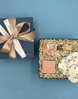 Shine On gift box with pastel matches, gold wish sparklers and coconut rose shower steamer. Beautifully wrapped.