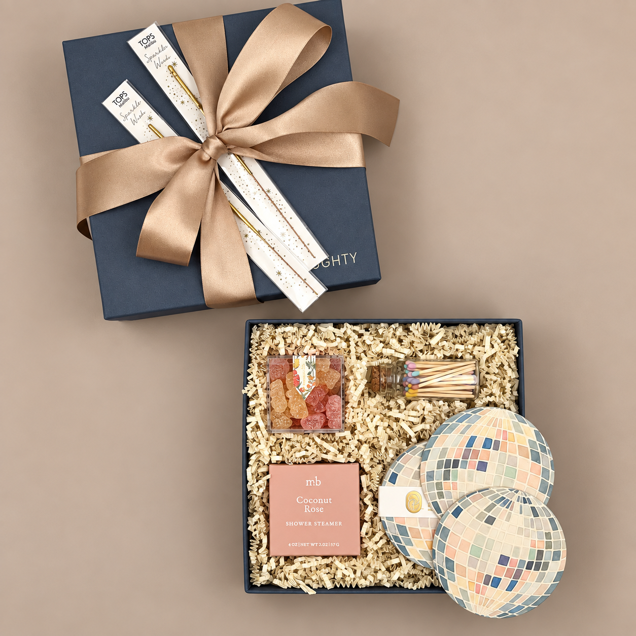 Watercolor mirror ball coasters with Bubbly Bears gummy candy in a celebratory gift box tied with a brone bow.