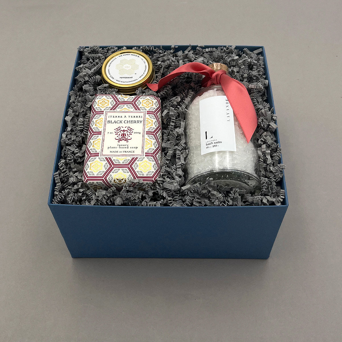 Gift set with spa products in a blue box on a gray background