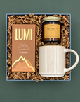 Sweater Weather gift box with salted caramel hot chocolate, ribbed stoneware mug, and Vetiver + Tonka candle.