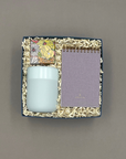 Take Note gift box featuring a mint travel tumbler, lavender pocket notebook, and Champagne Bubbly Bears candy in a white Thoughty box tied with a satin ribbon.