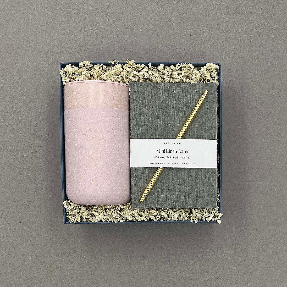 Take Note Gift Box featuring a pink travel tumbler, linen pocket notebook, and a gold pen.