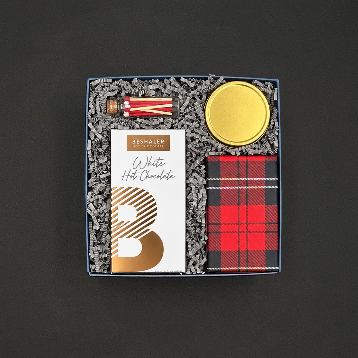 Warm Wishes holiday gift box with white hot chocolate, chocolate chip cookies, Snow & Pine candle, and peppermint-striped matches.
