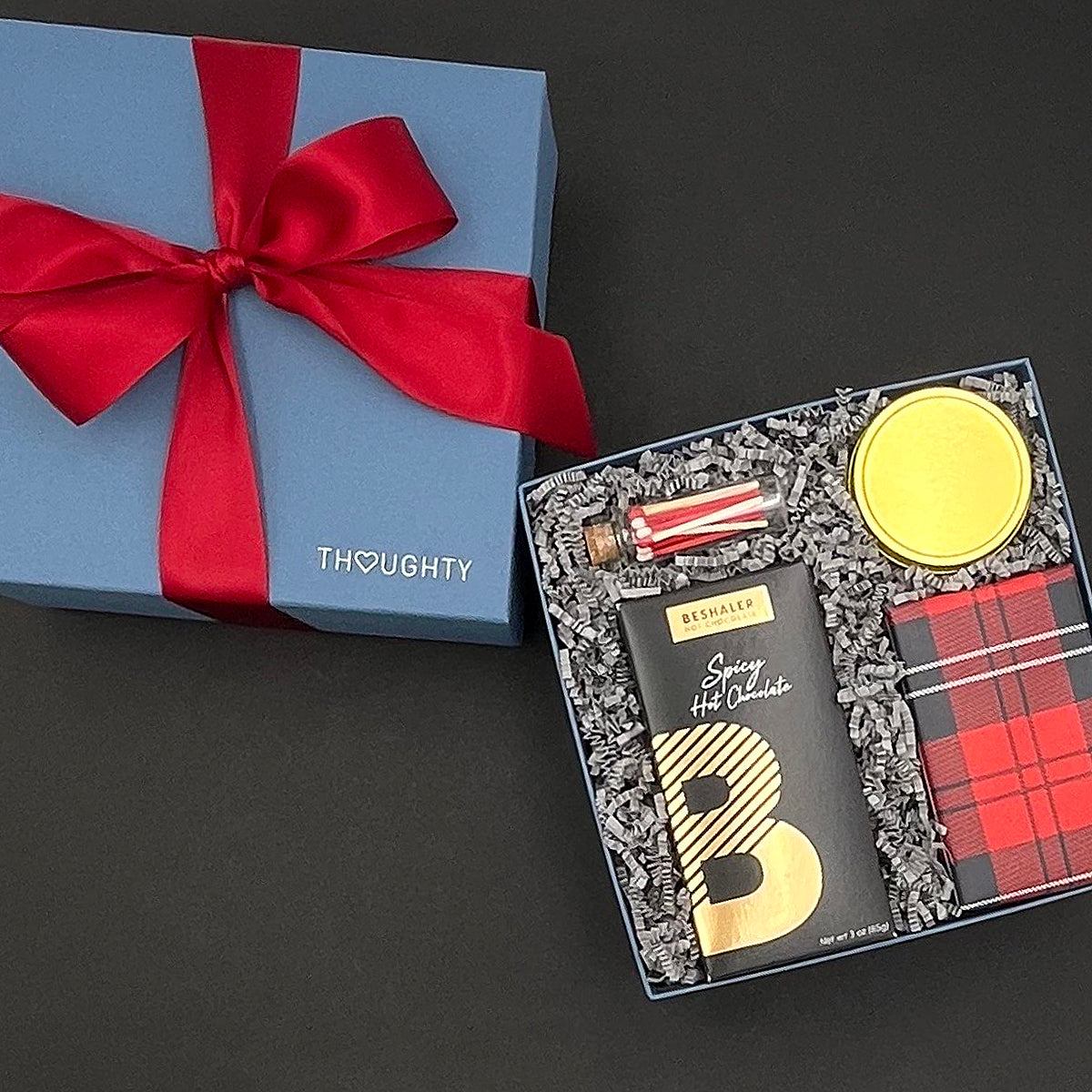 Entire Warm Wishes corporate holiday gift box tied with a satin ribbon.