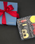 Entire Warm Wishes corporate holiday gift box tied with a satin ribbon.