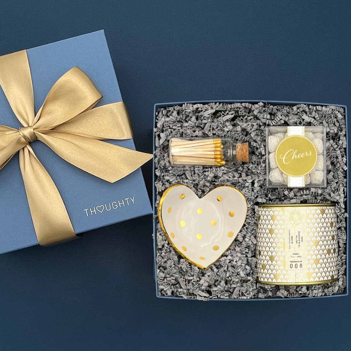 Celebrate Gift Box with white and gold vase, heart ring dish, Champagne Bubbles gummies, and Candlefish candle