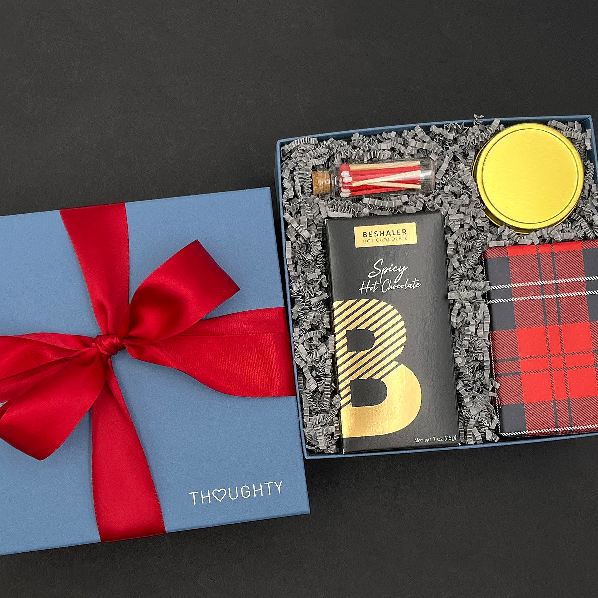 Close-up of Spicy Hot Chocolate and Ginger Snap Cookies in festive packaging.